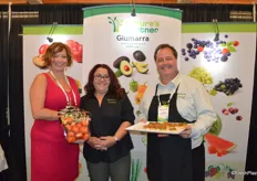 Kristina Lorusso, Kristin Lopez and Gary Caloroso with Giumarra. Kristina proudly shows a pouch bag of persimmons. Giumarra has the largest persimmon program in the country and the first varieties will be available as of September.